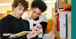 Two people reading a reprint, showcasing how reprints support journal visbility.