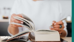 A man checking things in a book.